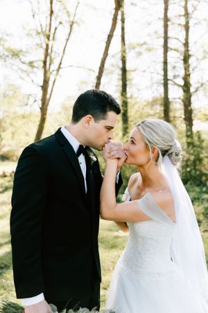 A couple pose for their wedding portraits on their wedding day in Tahlequah, Oklahoma.