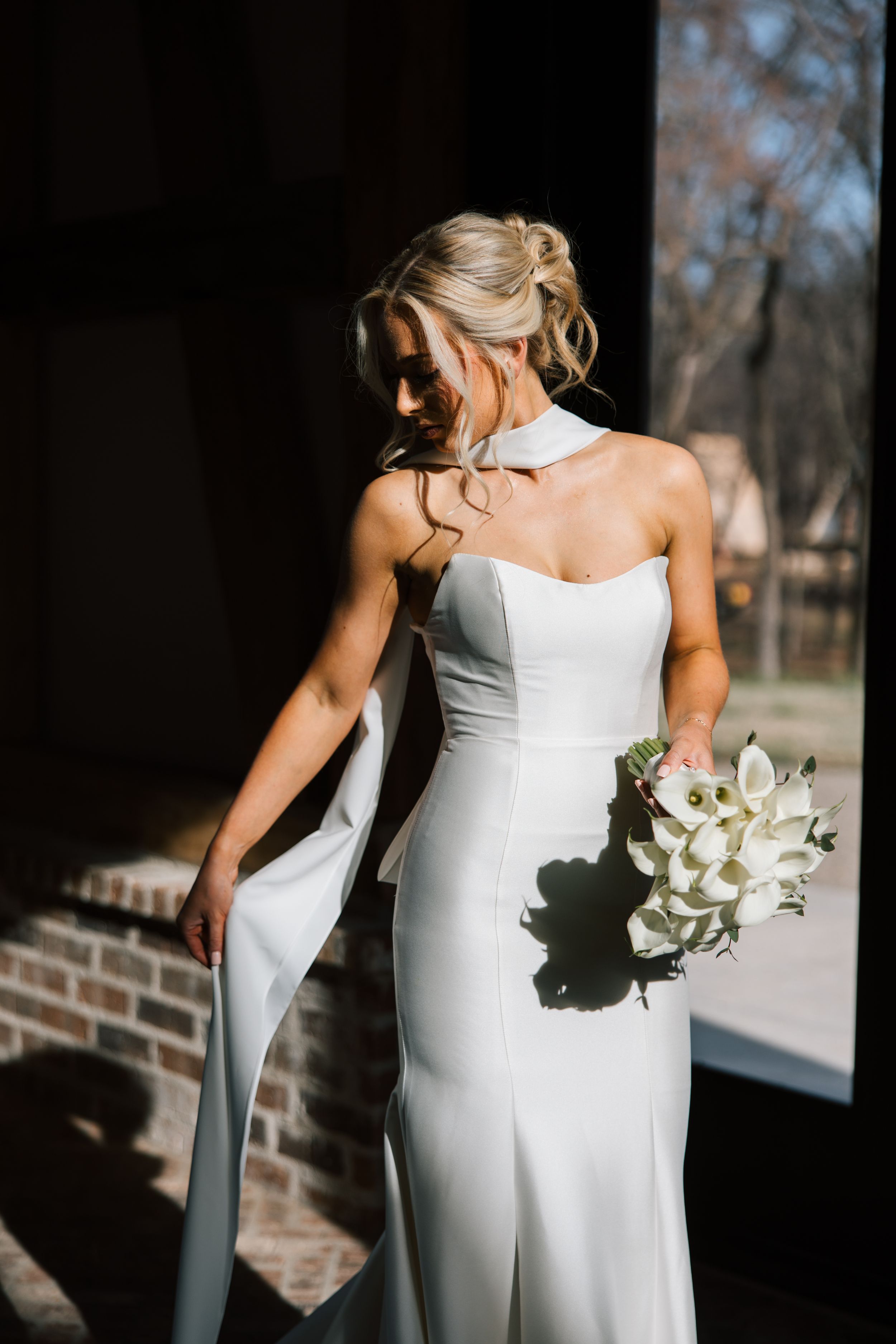 A bride poses during a styled workshop at 1684 Venue and Resort in Cookson, Oklahoma.