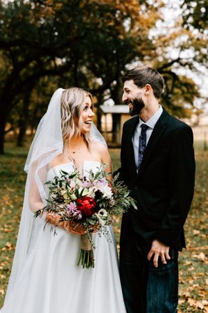 A bride and groom's portraits on her wedding day located on the family sheep farm in Early, Texas.