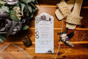 A wedding flatlay with rings, bouquet and shoes for an Oklahoma summer wedding.