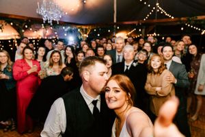 A bride takes a selfie during her wedding reception in Abilene, Kansas on her wedding day.