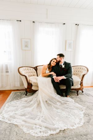 A couple pose for their wedding portraits in the bridal suite of their wedding venue at Bridle Creek in Sperry, Oklahoma.