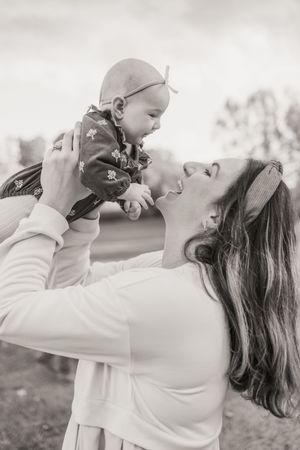 Black and white portraits captured during an intimate outdoor family photography session.