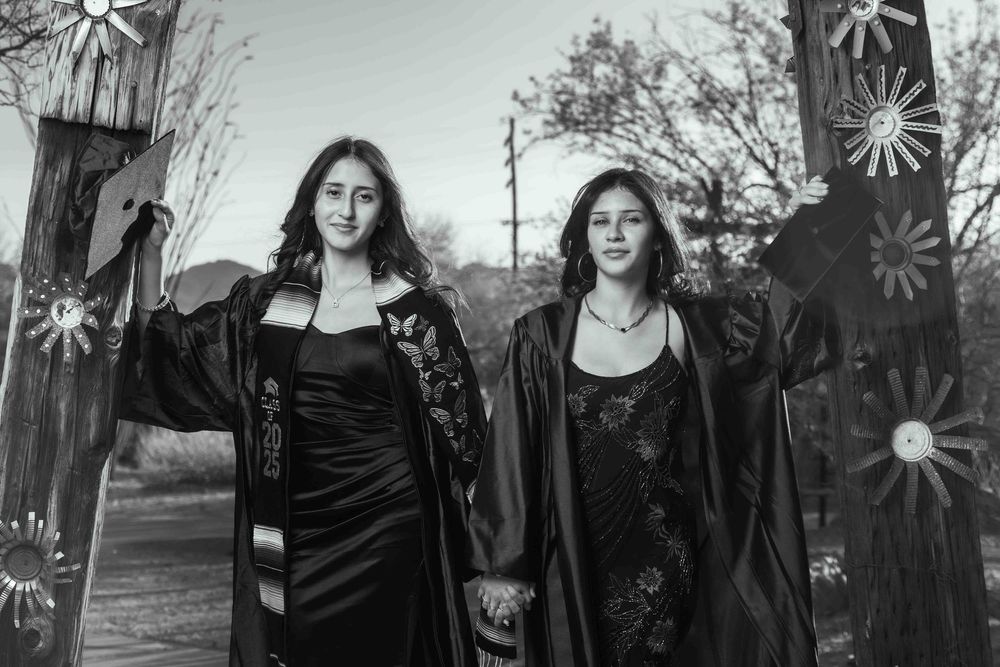 two beautiful girls graduating