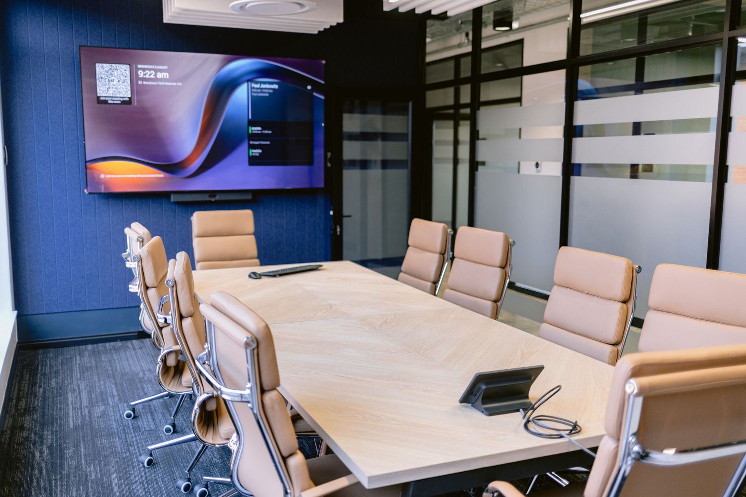 Wide-angle interior photograph highlighting a modern conference venue.