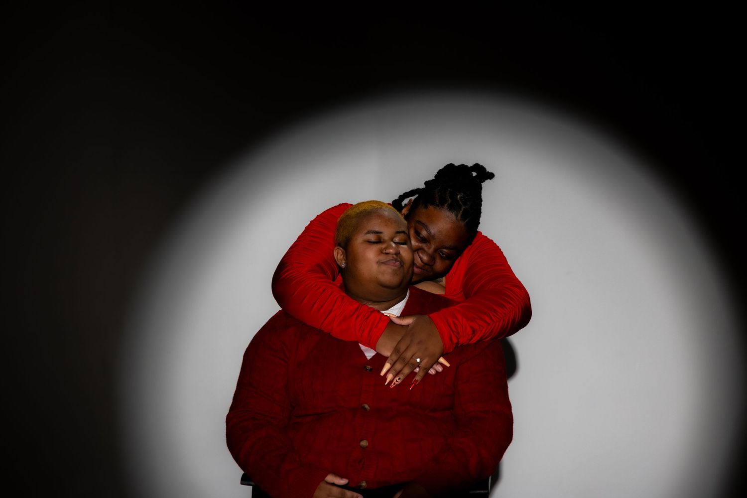 Six dark silhouettes against a black background show intimate embraces in a dramatic artistic photo series.