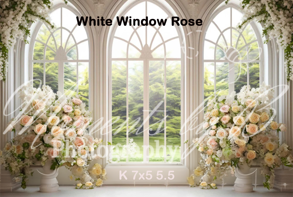 Elegant arched windows with white frames adorned by lush floral arrangements creating a romantic garden view.