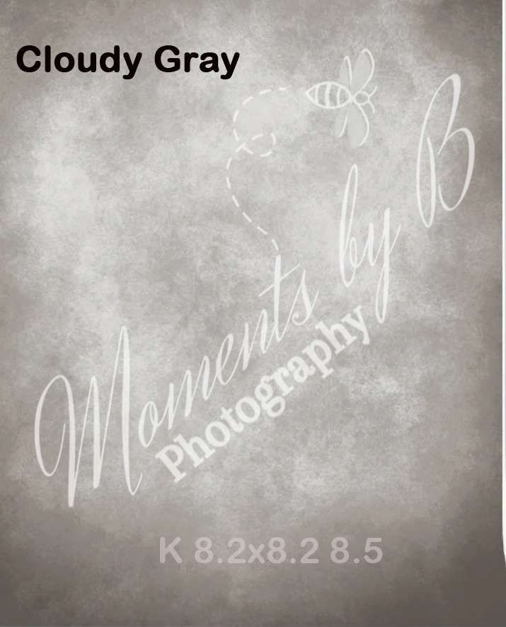 Cloudy gray gradient background with elegant script watermark and bee design.
