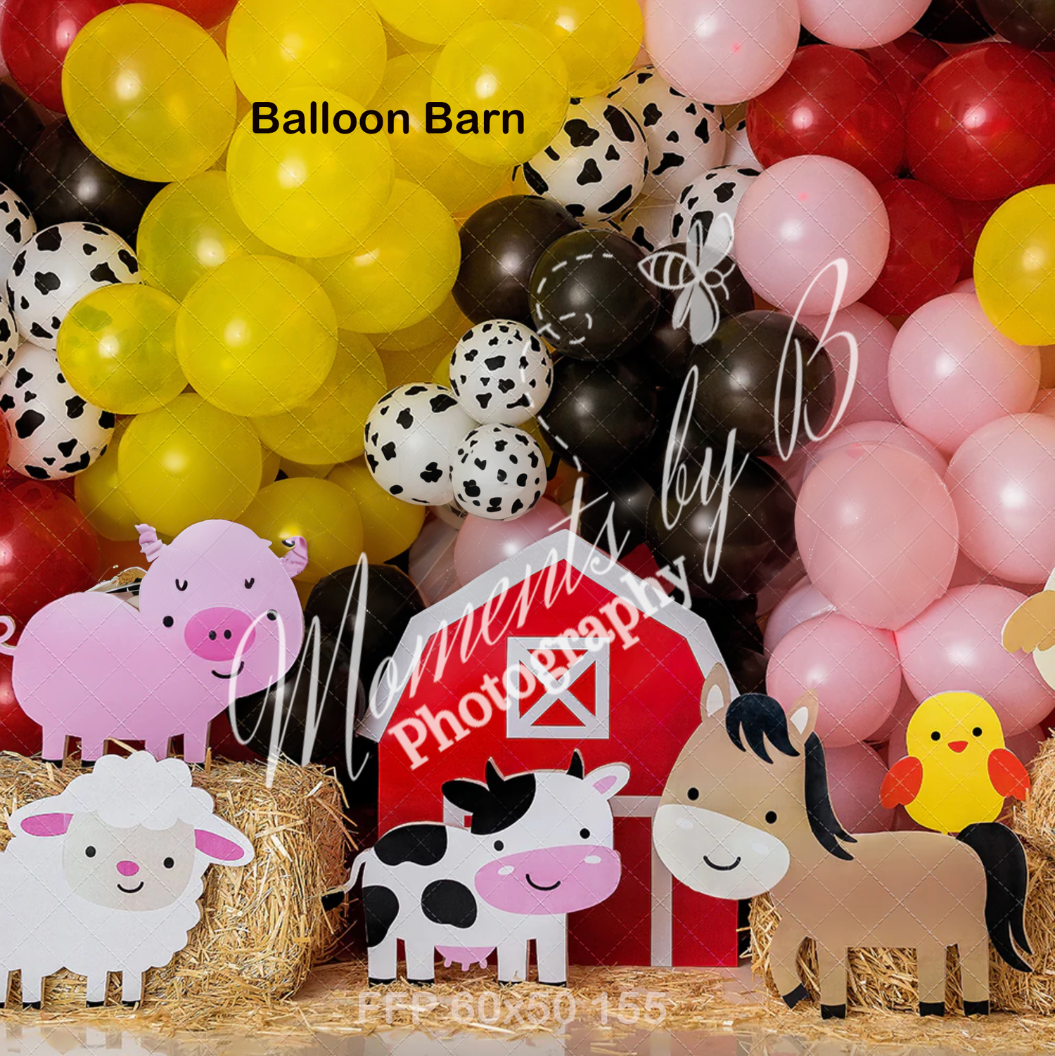 Festive balloon arch with farm animals and barn decorations in yellow, pink and black.