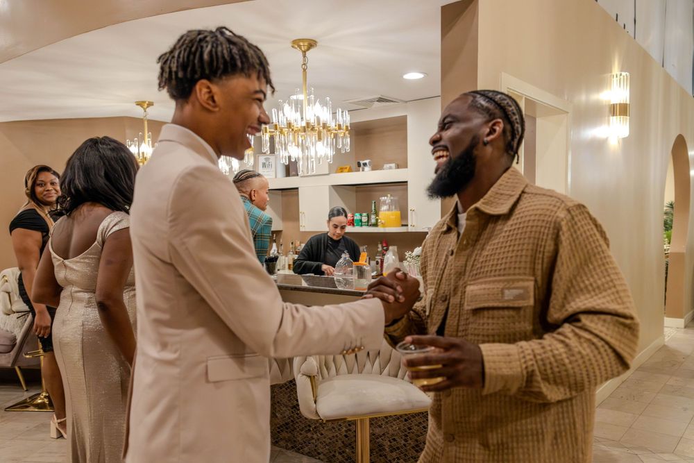 Wedding guests share joyful moments at an elegantly decorated reception.