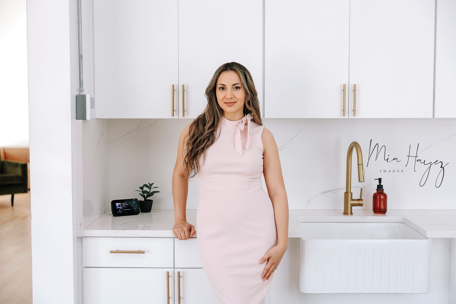 Elegant lifestyle photoshoot in a bright modern white kitchen interior.