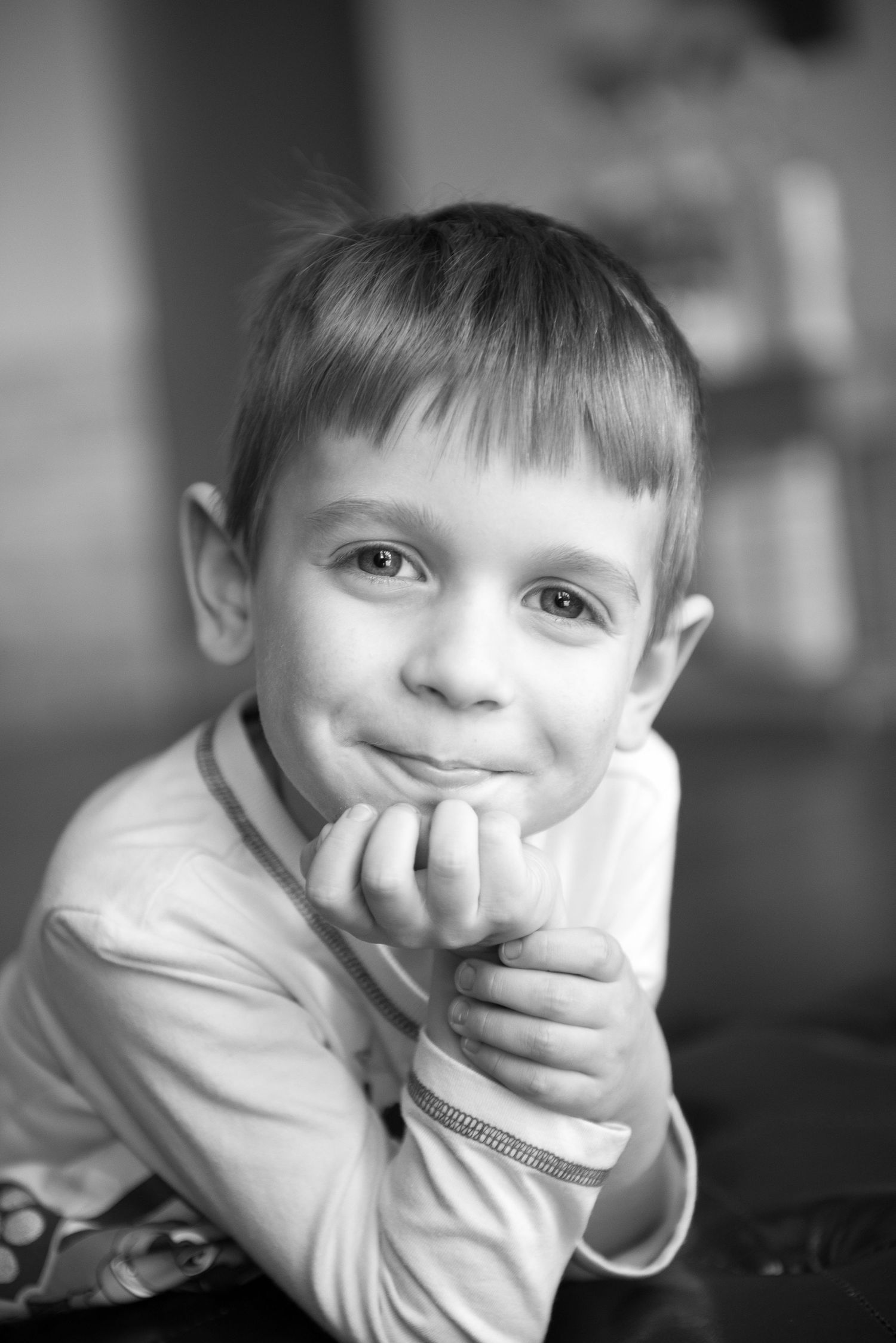 Little boy with hand on chin