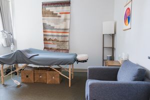 Maple Valley, Acupuncture, WA interior branding of client treatment room of table, wall posters and supplies, tools