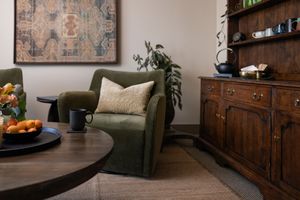 Talks Over Tea Mental health therapist office space in Tacoma, WA comfy couch and tea China hutch and table branding photo for business