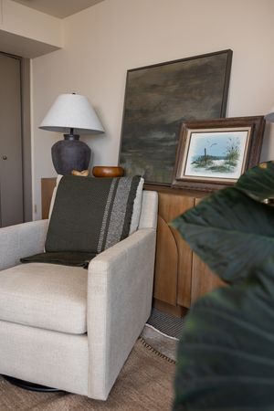 Talks Over Tea Mental health therapist office space in Tacoma, WA cozy, warm interior room for client to talk chair, table, art, lamp, plant