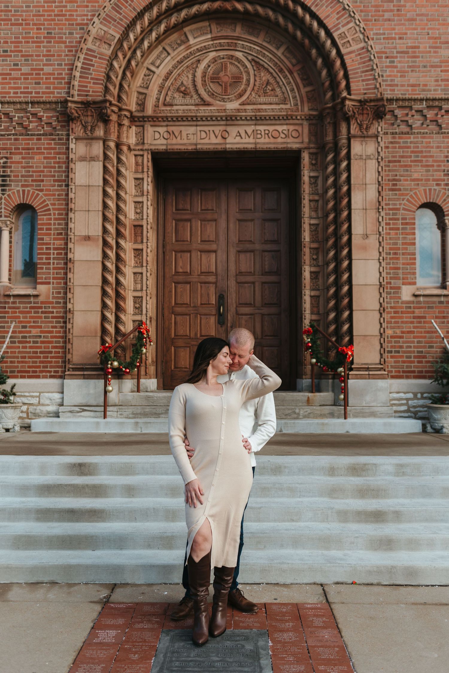 Series of romantic engagement photos taken in front of a brick church with ornate doorway.