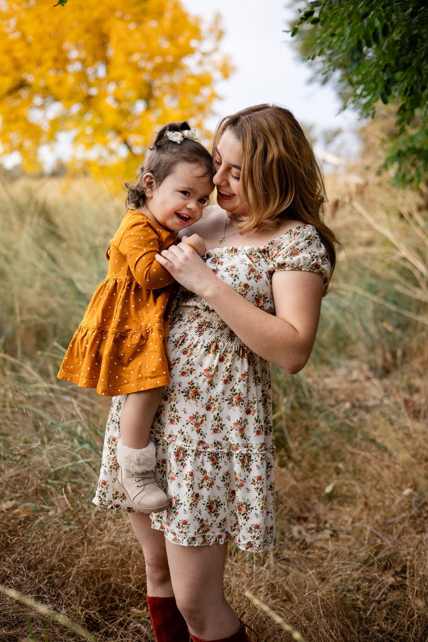 A high school senior holding her younger sister