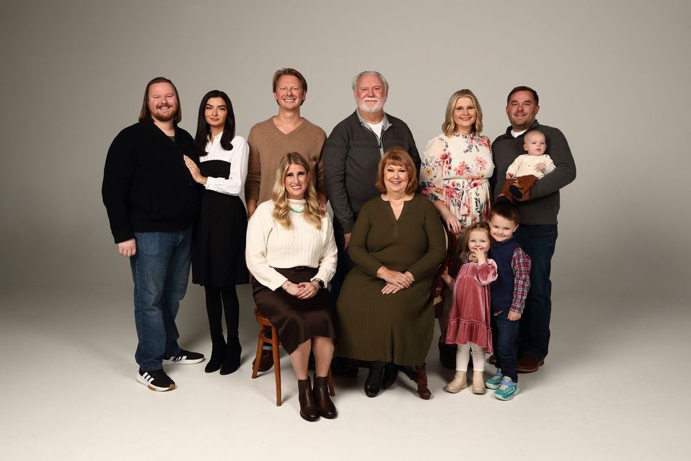 A series of professional family portrait photographs arranged horizontally showing different poses against a neutral backdrop.