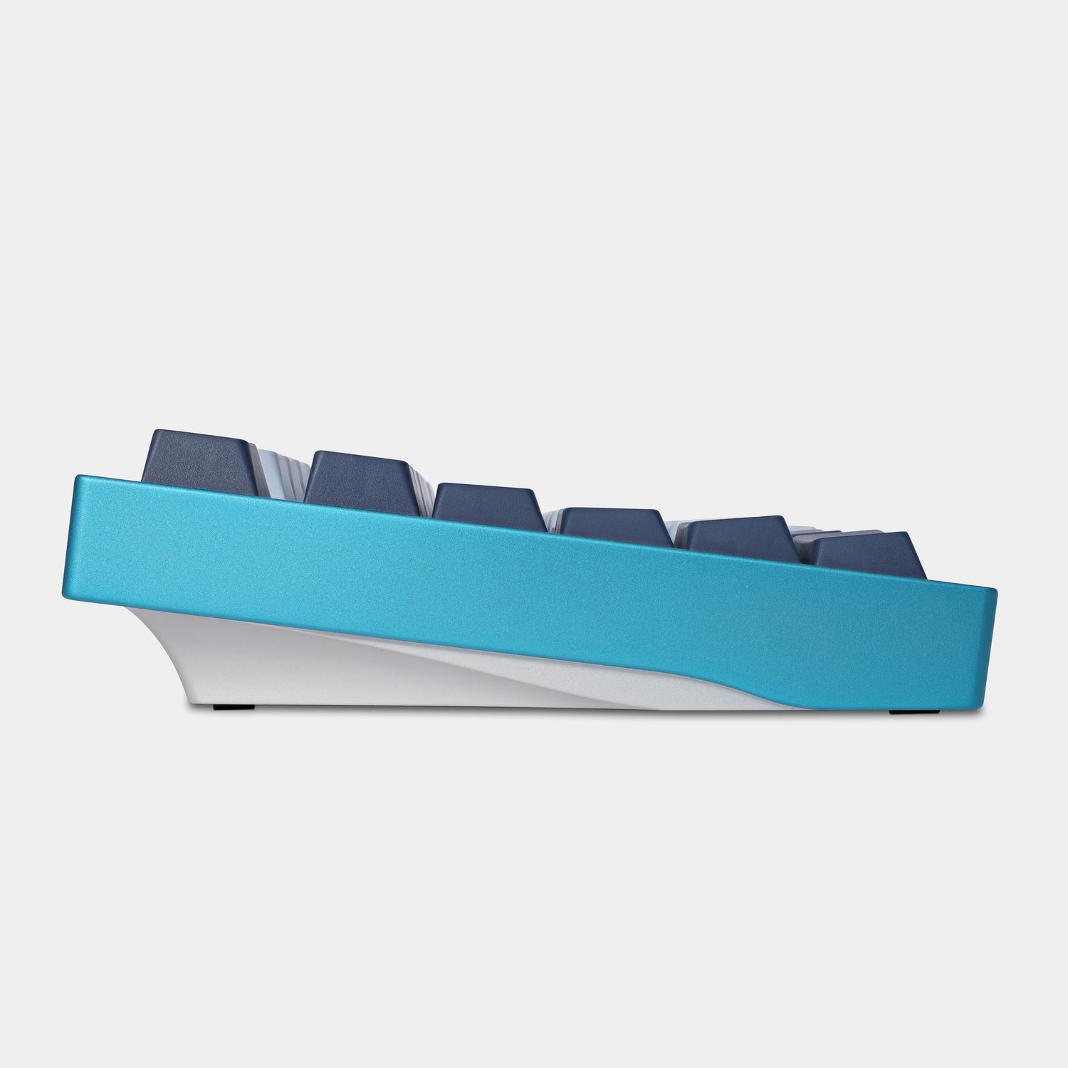 Side view of a turquoise and gray mechanical keyboard displaying ergonomic slope.