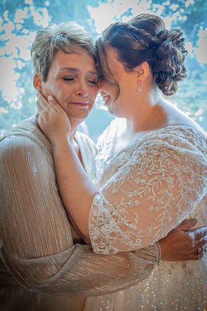 Bride and her mother share a heartfelt moment before the ceremony