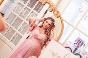 candid moment of woman getting ready in mirror