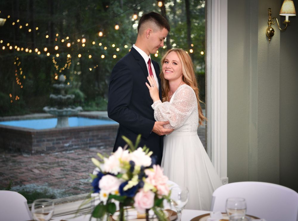 A bridal couple inside, overlooking the courtyard fountain in gorgeous Southeast Georgia. Wedding and Event Venue Wayne County and more