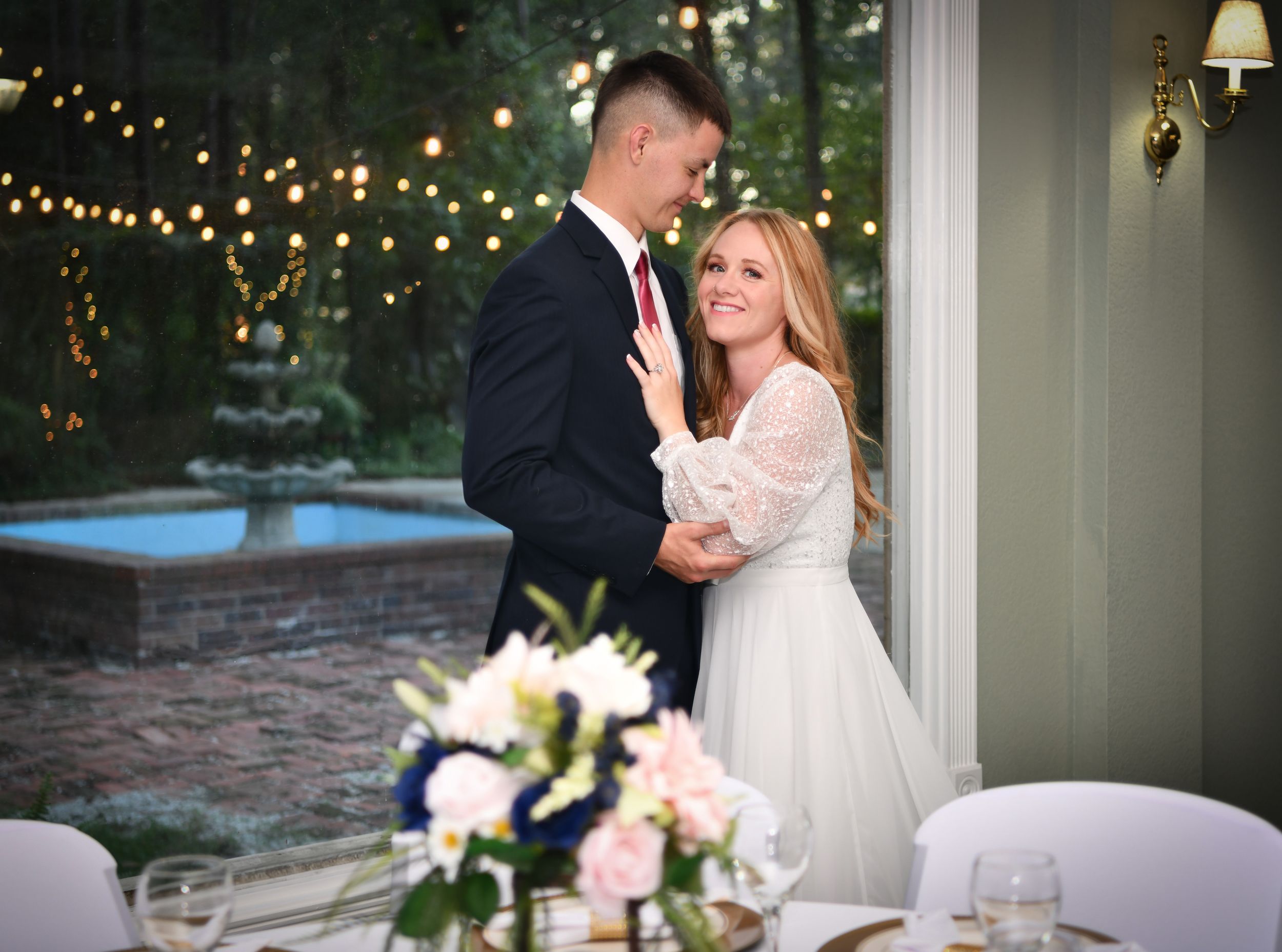 A bridal couple inside, overlooking the courtyard fountain in gorgeous Southeast Georgia. Wedding and Event Venue Wayne County and more