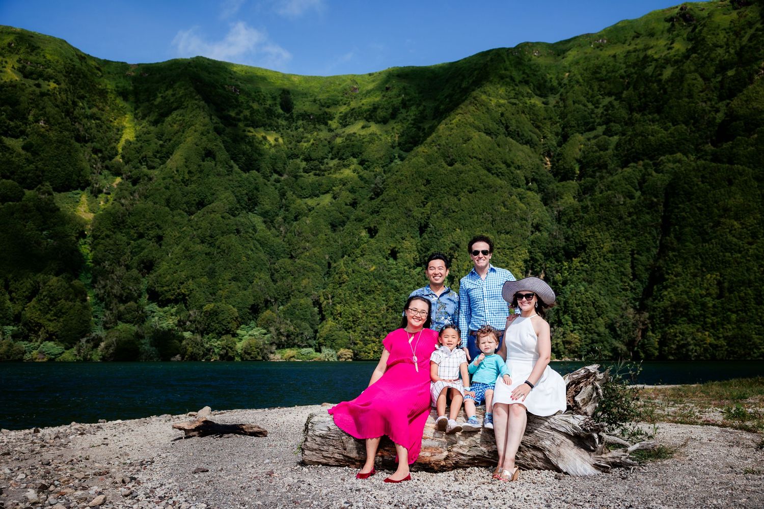 Parents and children sharing a playful moment in the great outdoors.
