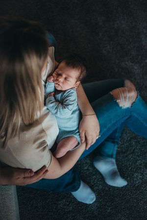 Moody, in-home photography session - sleepy baby snuggles captured in Dickinson, ND