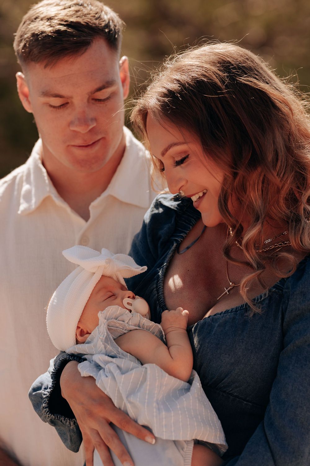 parents looking at their newborn