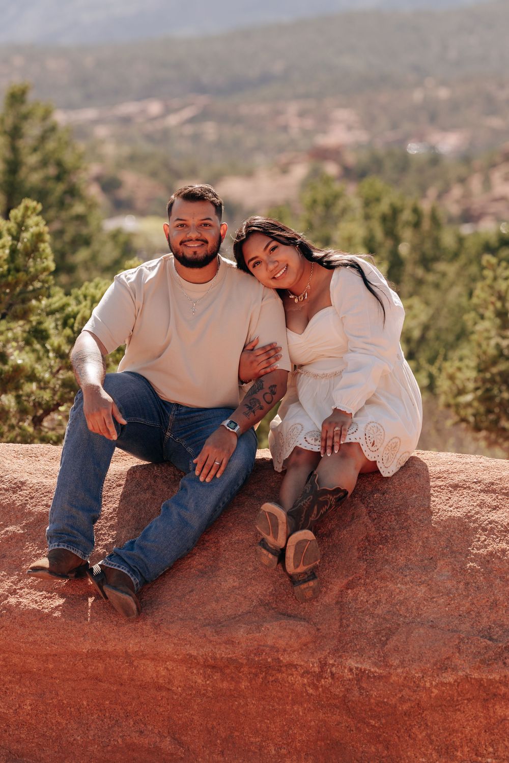 couple sitting on rock