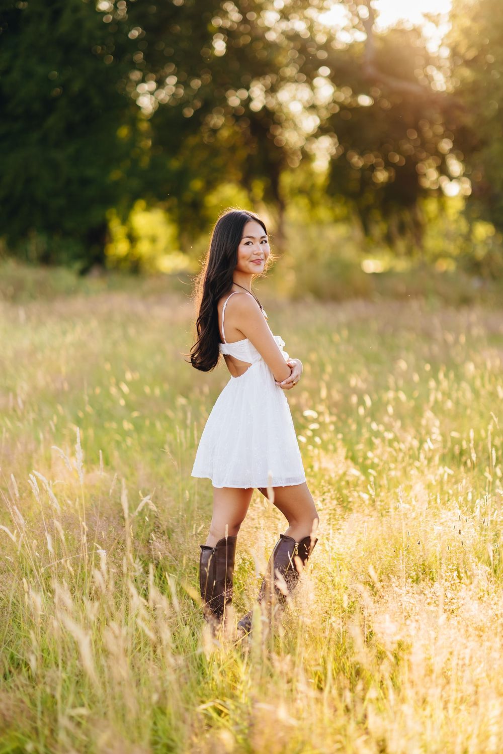 A series of sunset portraits in a golden field of tall grass and wildflowers during magic hour.
