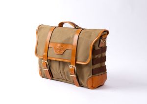 Stylish canvas and leather messenger bag in olive green with brown leather trim and brass buckle closures.
