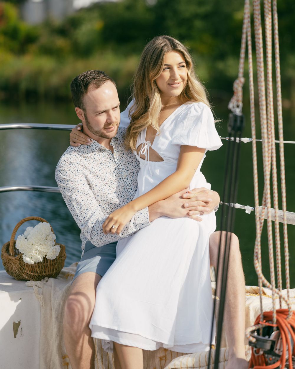 Romantic couple spending time together on a boat dock during a sunny day.