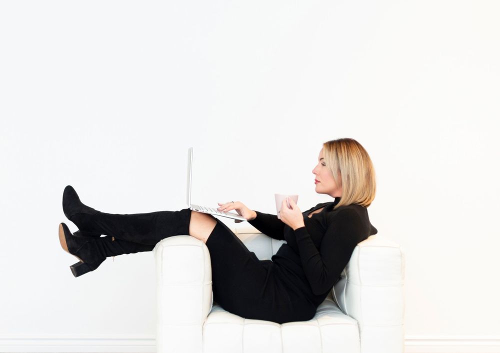 Person in black clothing lying down on white surface in different relaxed poses.