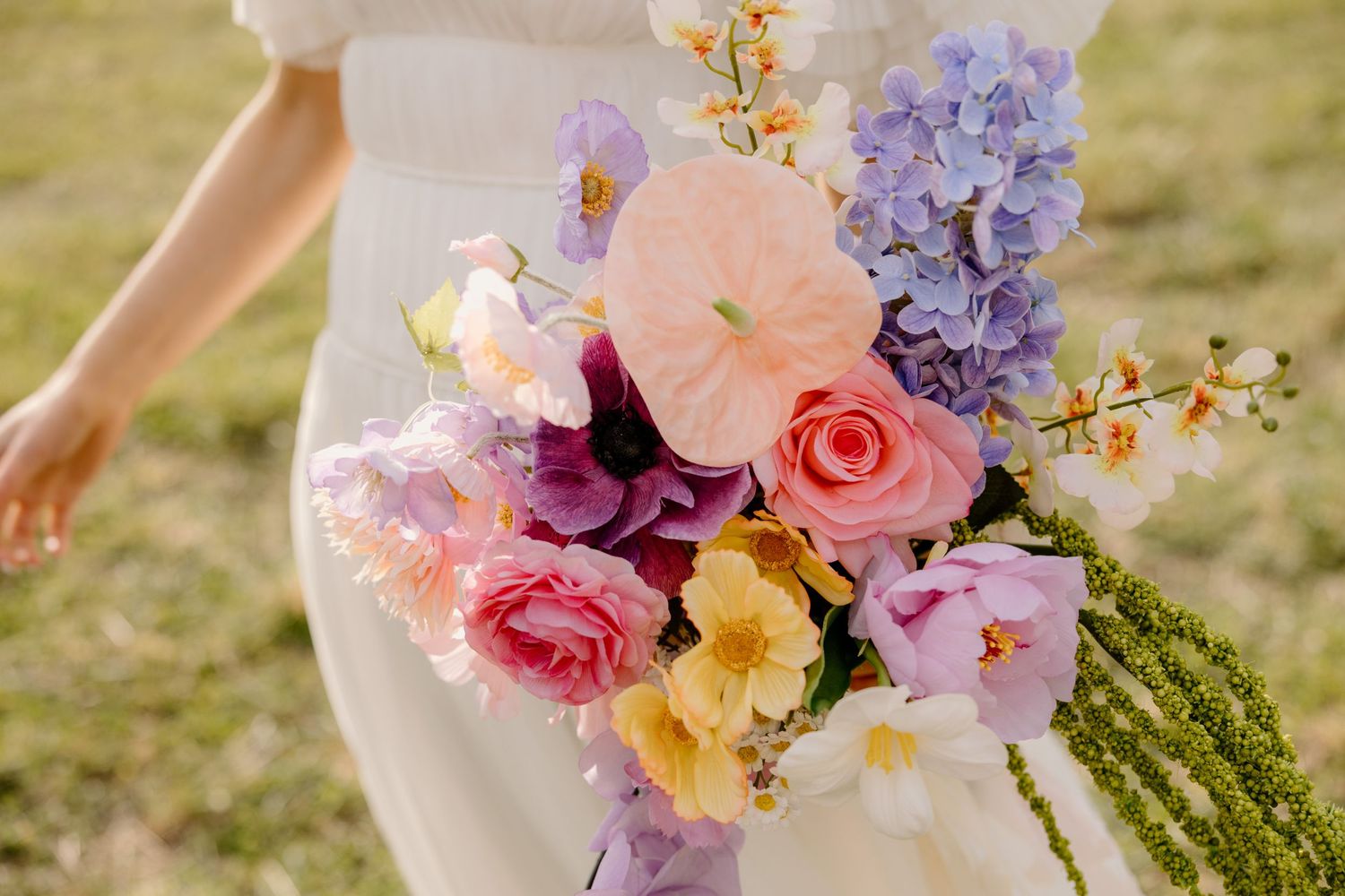 Beautiful wedding bouquet with pink roses, hydrangeas and pastel flowers against sunlit background Captured near Ararat Victoria.