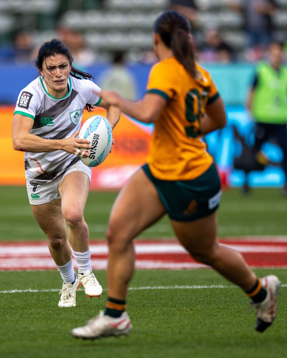 Irish Women's Rugby Sevens player advances the ball up the pitch against Australia in Los Angeles. Sports Photography
