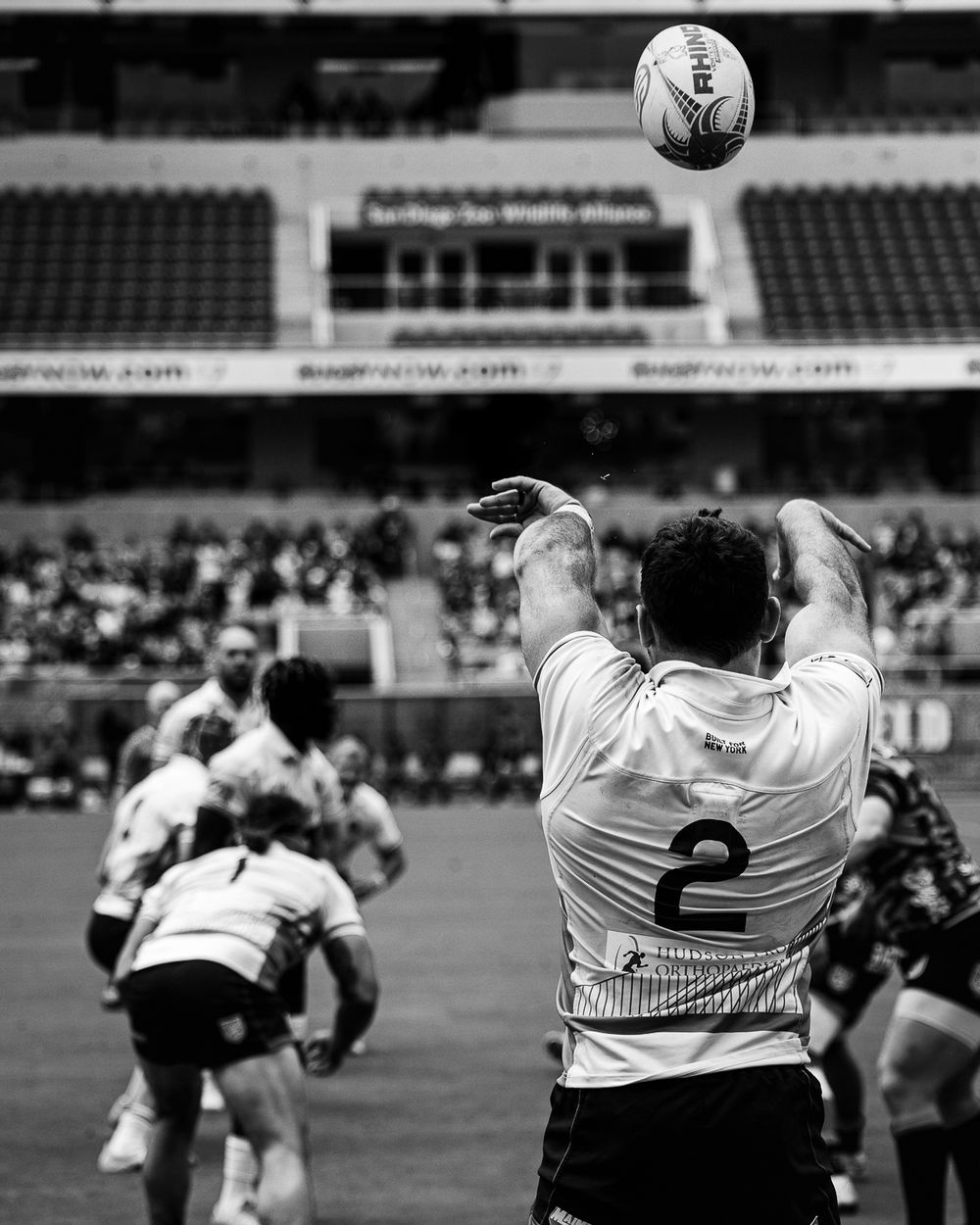 Professional Rugby player throws ball into play during a match in San Diego. Sports Photography