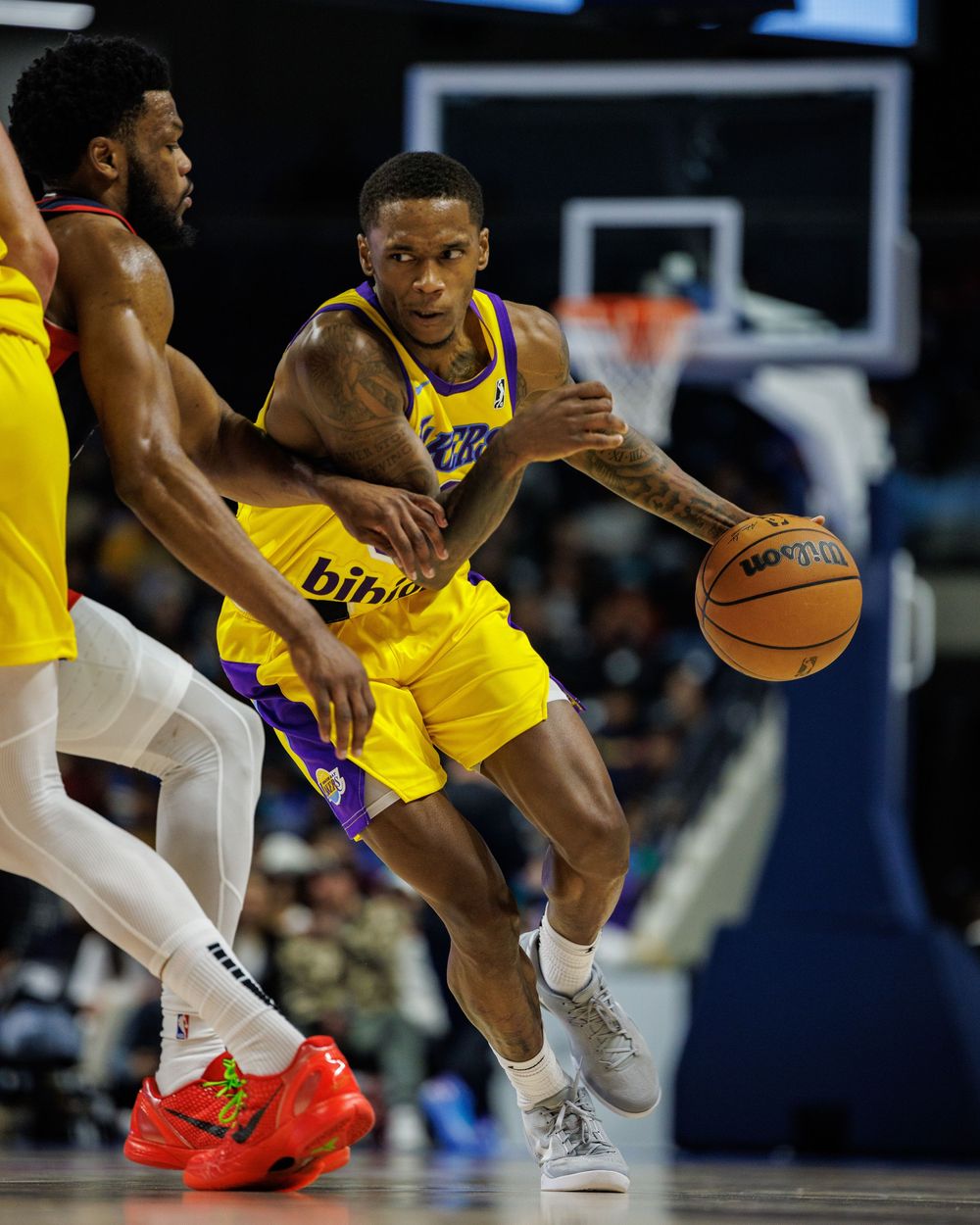 Basketball player makes a drive towards the hoop in a NBA G Lgeaue Game in Oceanside California, Sports Photography