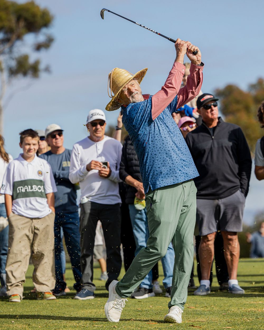 Golfer hits a shot from the fairway on a golf course in San Diego, sports photography