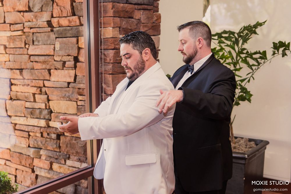 Series of photos showing groomsmen helping with wedding preparations against a stone wall backdrop.