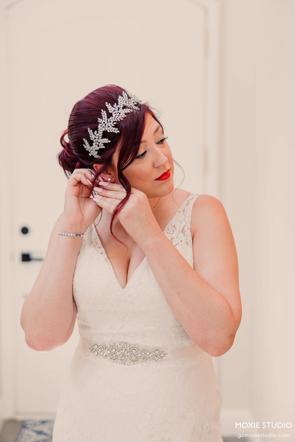 A close-up sequence shows a silver leaf crown being adjusted on a white wedding dress.