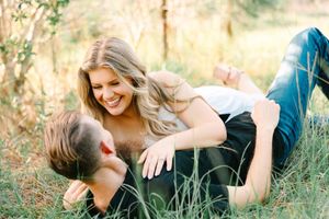 A series of outdoor portraits showing someone lying in tall grass during a golden hour photoshoot.