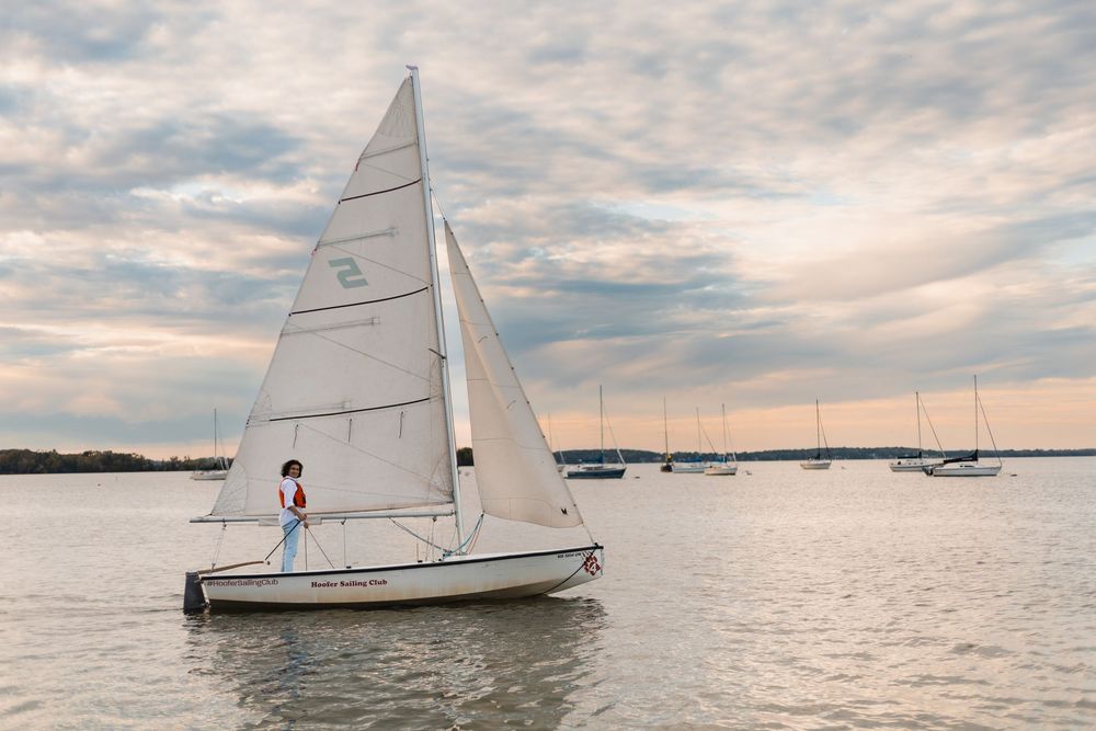 madison wi high school senior photographer yearbook photos uw campus memorial union terrace boy sailing boating sunset water lake mendota