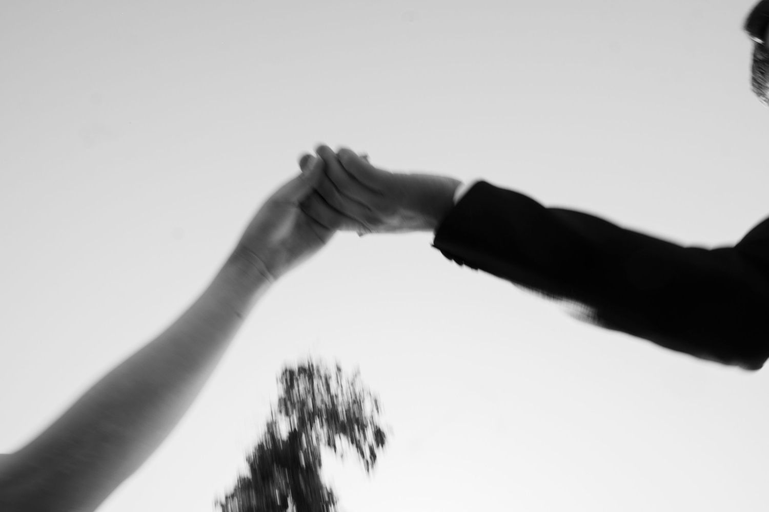 Abstract black and white motion blur of hands in sequence.