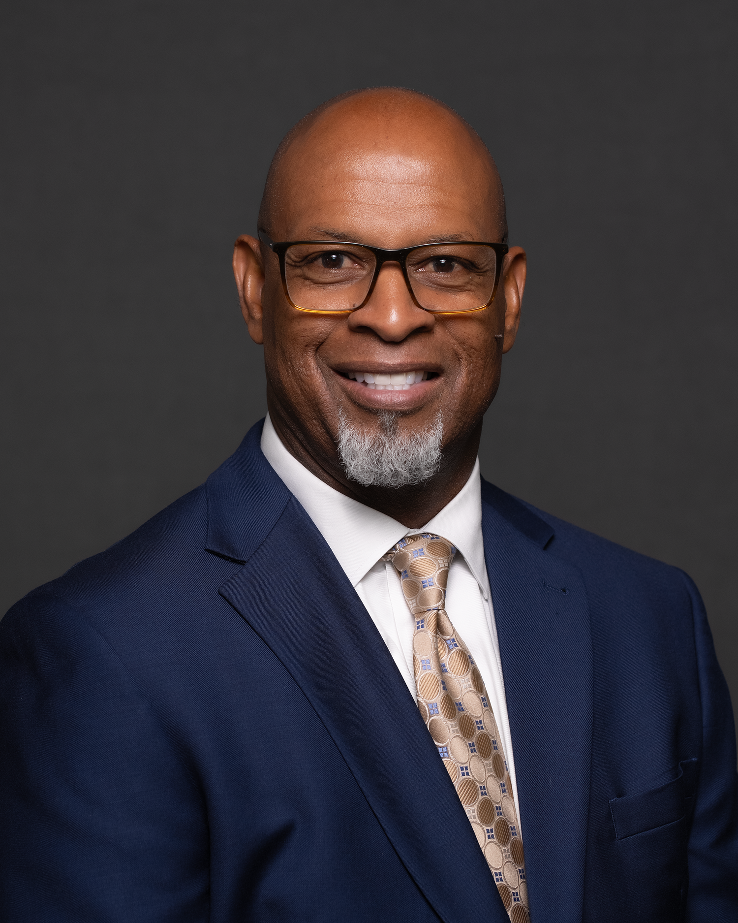 Professional headshot of a confident African American man. corporate, leadership, or executive branding
