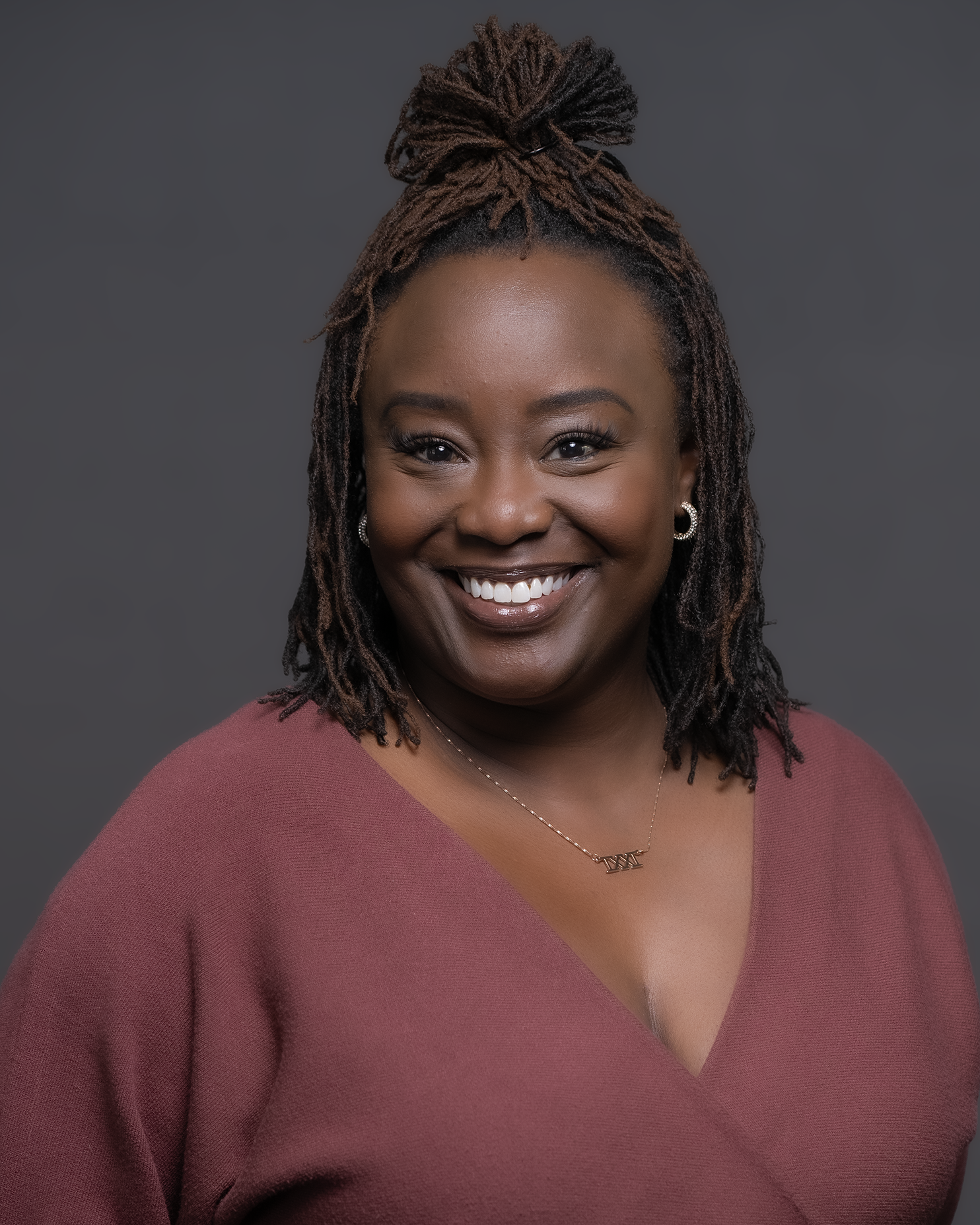 Professional headshot of confident woman