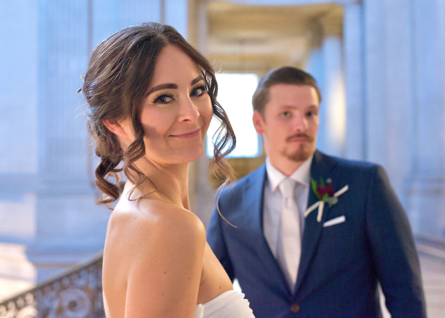 Photograph of a bride and groom who were just married at San Francisco City Hall in San Francisco California by William Wayland