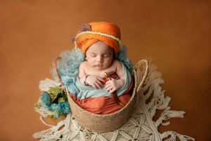 new born baby in the basket - Jasmeet K Photography