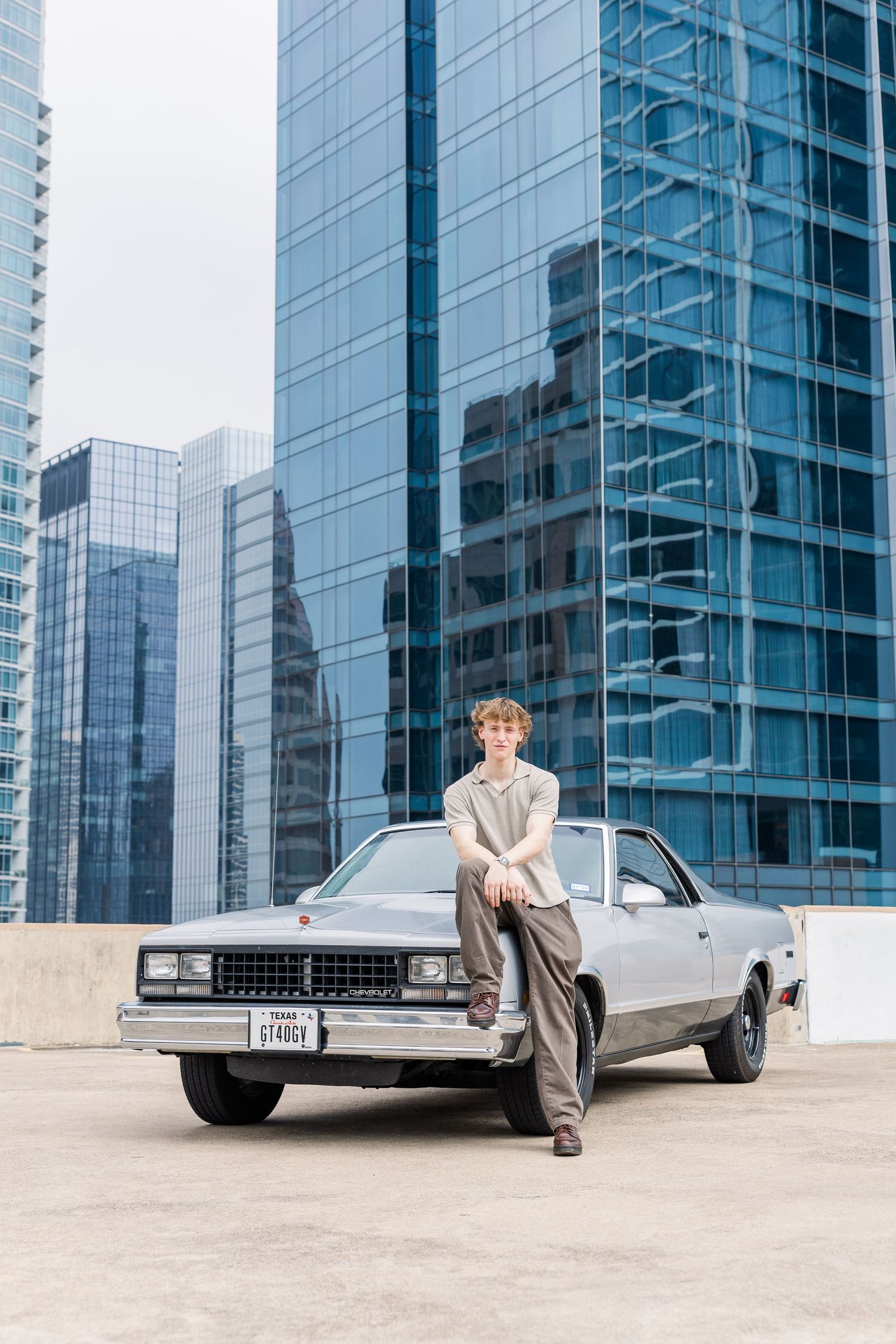 man thinking in front of building evening